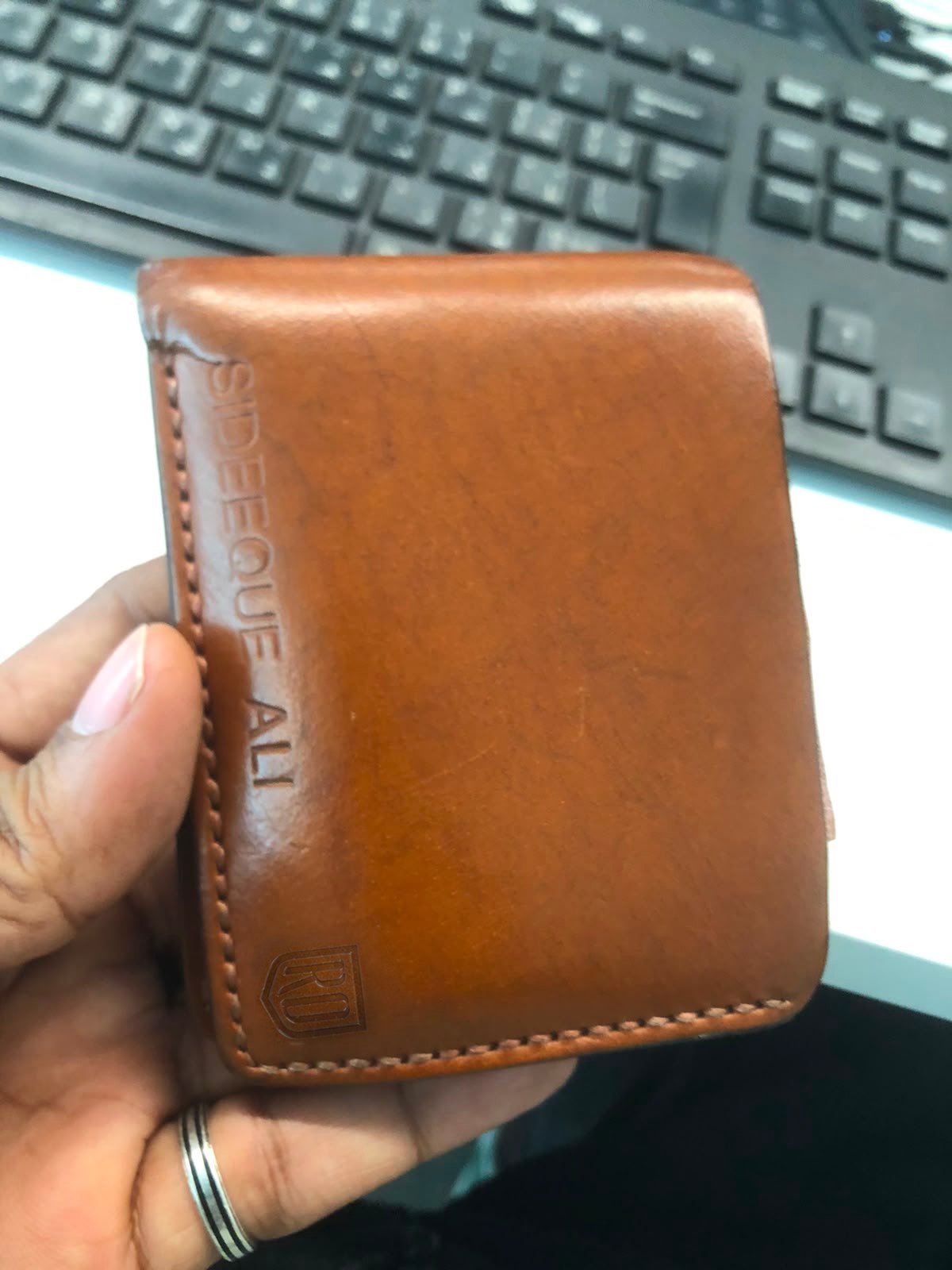 Rox & Oak leather wallet after long-term use showing natural patina