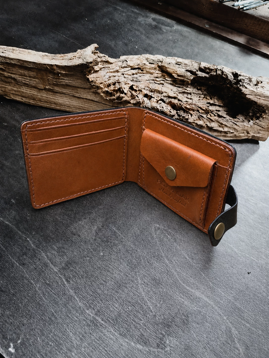Handcrafted leather wallet displayed on rustic wooden background with premium artisan craftsmanship style.