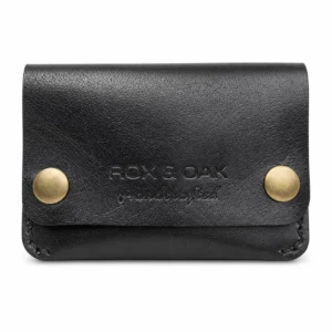 Rox & Oak Terra handcrafted black vegetable tanned leather card holder wallet with antique brass snap buttons on white background