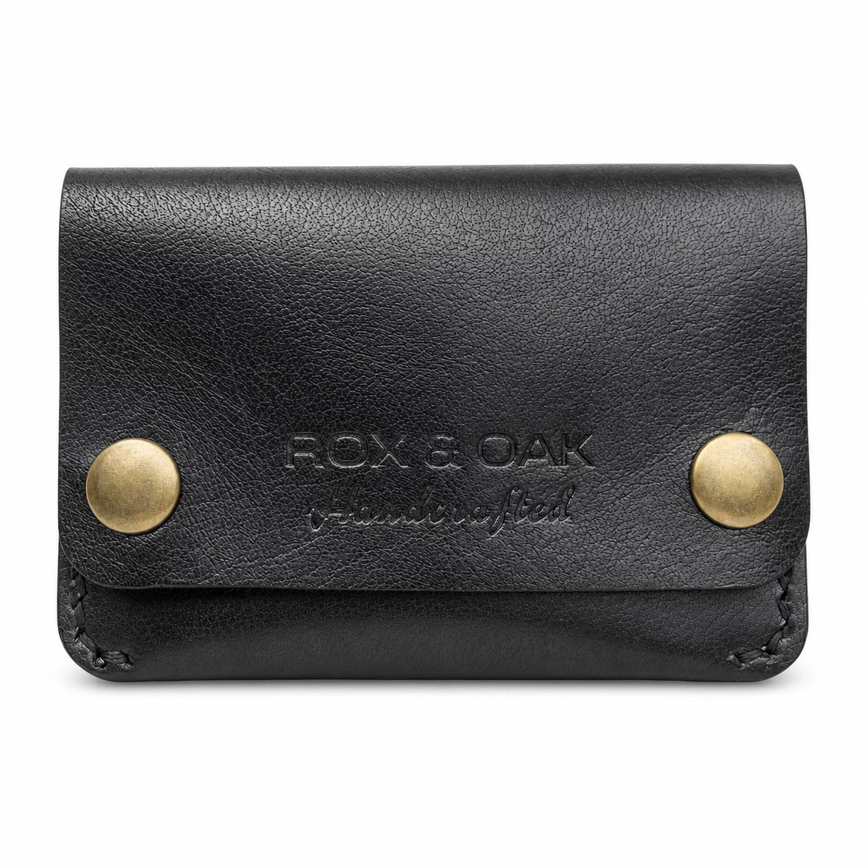 Rox & Oak Terra handcrafted black vegetable tanned leather card holder wallet with antique brass snap buttons on white background