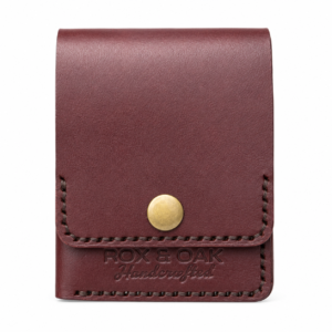 Front view of Rox & Oak veg tan leather slim wallet with brass snap button.